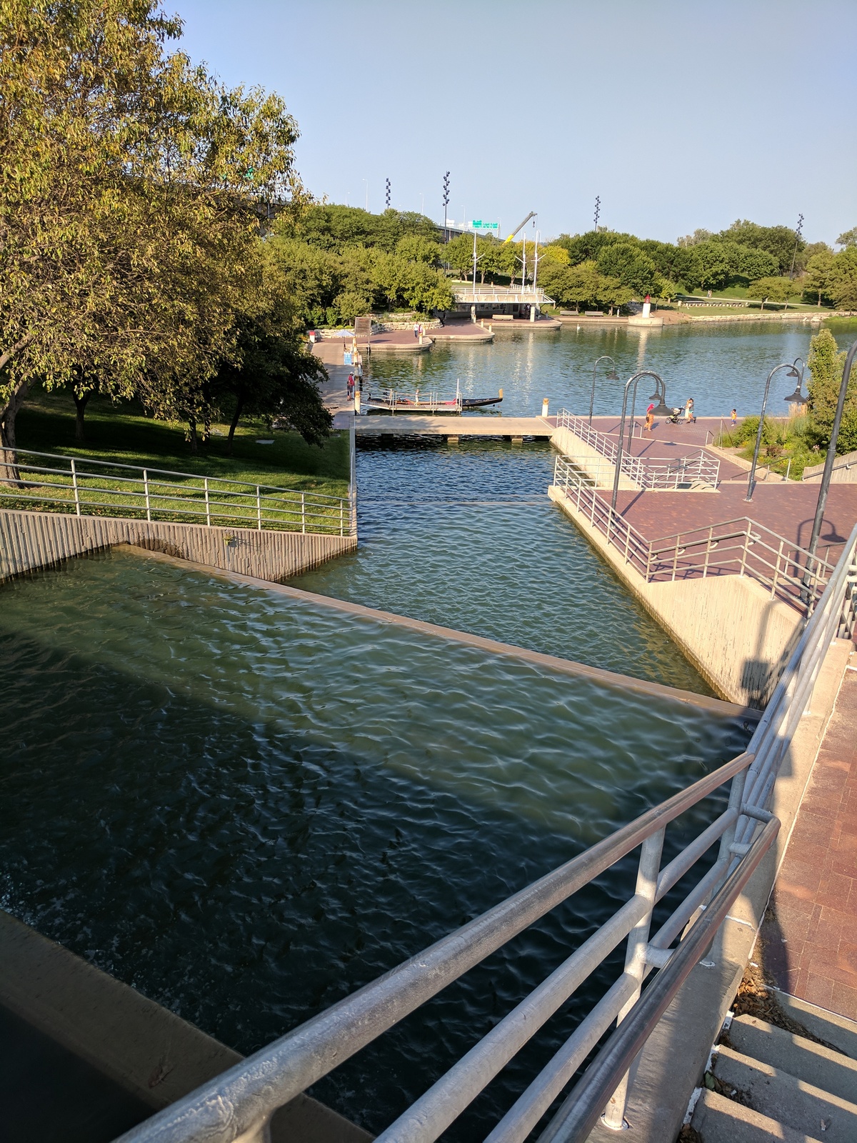 Water flowing down steps into a small body of water