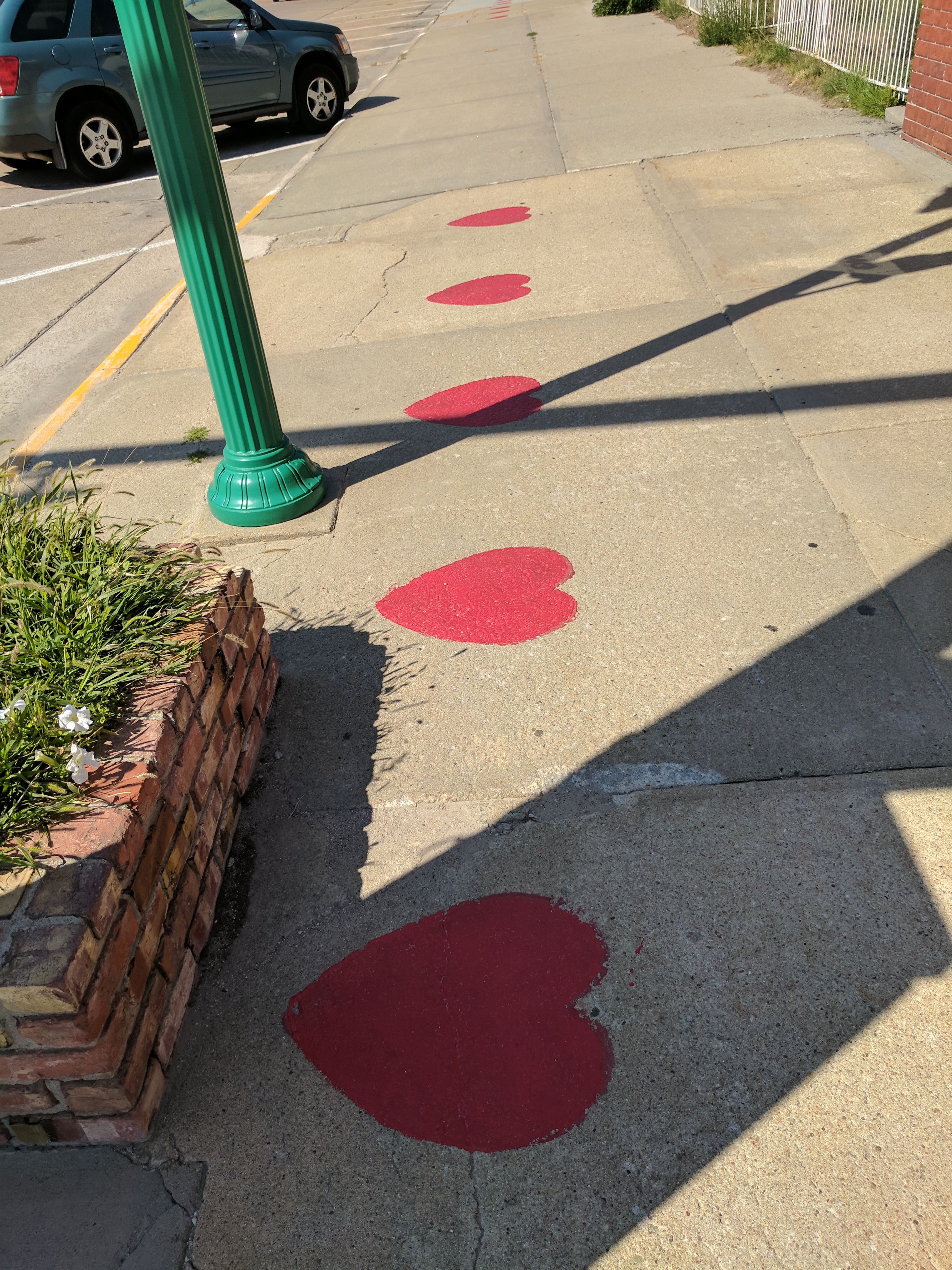 Hearts spray painted into the sidewalk in Valentine